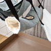 Close up rat hammock hanging in cage showing fleece lining and straps for pet rats
