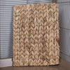 Woven mat with a braided pattern in a cage